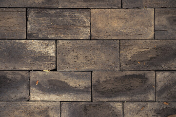 Background of bricks that are stacked and alternating.