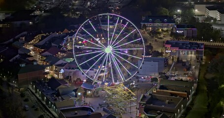 Pigeon Forge Tennessee Aerial v6 pan shot around the centre piece of the island great smoky mountain observation wheel at night - Shot with Inspire 2, X7 camera - November 2020