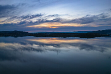 Sunrise and cloud reflections waterscape