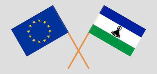 Crossed flags of the European Union and the Kingdom of Lesotho. Official colors. Correct proportion