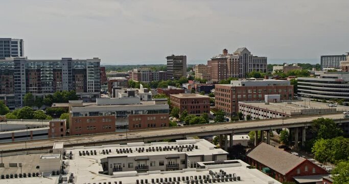 Greenville South Carolina Aerial v20 forward flying pan right shot overlooking at the elevated highway traffics and downtown cityscape - Shot with Inspire 2, X7 camera - May 2021