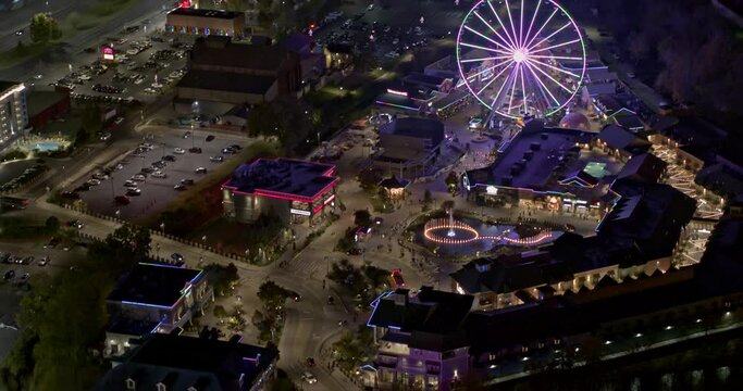 Pigeon Forge Tennessee Aerial v9 birds eye view leading shot toward illuminated the island theme park and surrounded city nightscpae - Shot with Inspire 2, X7 camera - November 2020