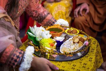 Indian pre wedding henna night interiors and decorations, ritual items close up