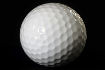 golf ball on the black background