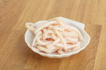 Marinated squid strips in the bowl