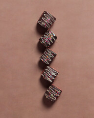 Cake roll with chocolate topping. Cake with a soft texture and has a sweet taste. Sweet snacks that are liked by toddlers to the elderly. Market snacks. Roll cake mockup. Focus blur.