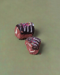 Cake roll with chocolate topping. Cake with a soft texture and has a sweet taste. Sweet snacks that are liked by toddlers to the elderly. Market snacks. Roll cake mockup. Focus blur.