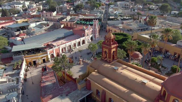 Saint Sebastian Temple At Plaza Principal Of San Sebastian Bernal In Queretaro State, Mexico. Aerial Orbiting