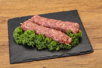 Raw minced beef kebab skewer