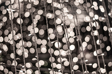 A beautiful night photo with the light from many small lanterns uniting into one kingdom to create the most beautiful circular bokeh image of the night.