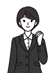 ガッツポーズのスーツを着た女性