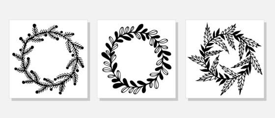 Festive wreaths from branches and herbs vector set. Hand-drawn doodles isolated on white background. Garlands with twigs, leaves, thorns, berries, holly. Monochrome botanical elements.