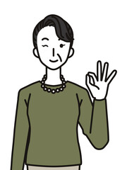 オッケーポーズのシニア女性