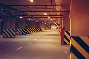 Empty parking place in a residential building. Covered underground parking for cars