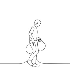 man carries in his hands two packages - one line drawing vector. concept of shopping or garbage disposal