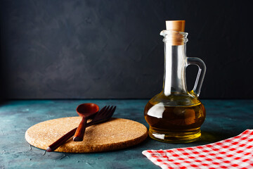 Background or wallpaper kitchen table with copy space, kitchen utensils, oil in a bottle. Organic...