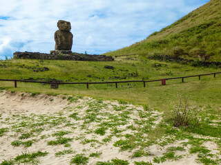 Fototapeta na wymiar Anakena beach on Easter Island. Sandy beach strip with coconut trees, moai statues and views of the Pacific Ocean, Chile, South America