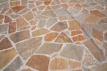 Orange old stone road surface in the future. Seamless Texture. The texture of a stone road. High...