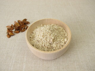 Gluten-free beechnut flour, ground beechnuts in a wooden bowl