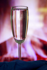 glass of water on colorful background