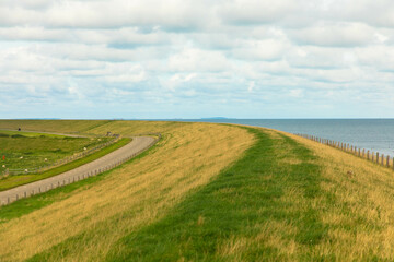Aerial view of the cycle path along the dike and the Wadden Sea. Texel island, Netherlands. Tourism and vacations concept.