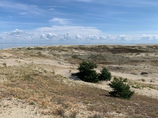 Beautiful dunes with seascape background, perfect surface of the sea