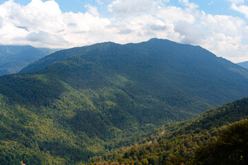 Scenic green mountains and beautiful sky clouds for background