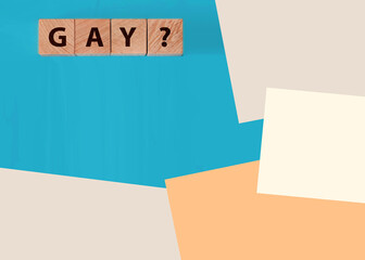 Gay word from wooden blocks on desk. LGBT concept