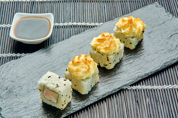 delicious baked crab rolls on a stone stand