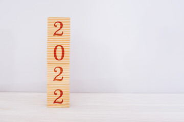 wooden cubes Happy New Year 2022. New Years concept, copy space, white background