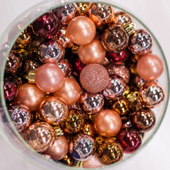 Shop counter with pink Christmas balls in a basket