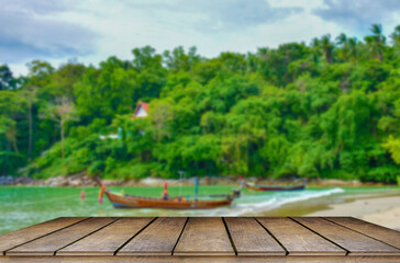 Fototapeta na wymiar Wooden table tops on the blurry Phuket sea floor..