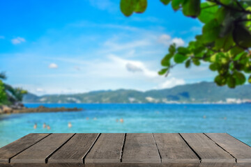 Wooden table tops on the blurry Phuket sea floor.