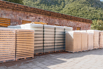 Packages with glass containers on the street near a warehouse at a wine or beer production plant