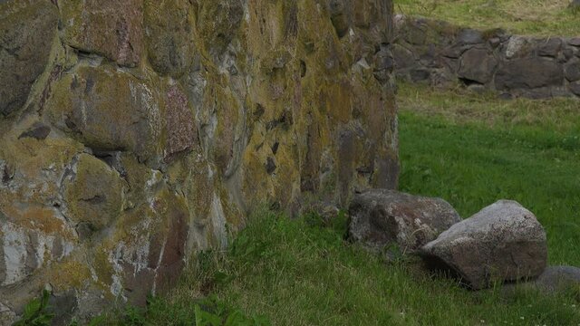 A close-up view of a boundary wall made of stone of a fortress.