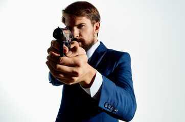 businessmen Secret agent with a gun in the hands of a crime isolated background