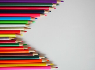 A horizontal row of colored pencils.