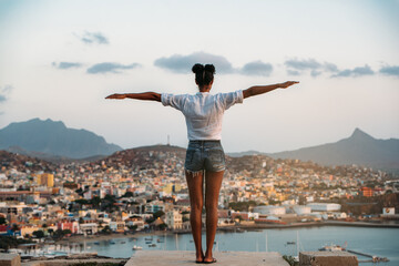 Woman looking at a beautiful city landscape