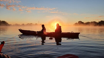 Sunrise kayaking on the river on a foggy morning © Jack photo