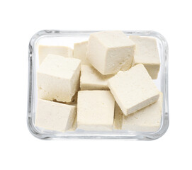Glass bowl with delicious tofu isolated on white, top view