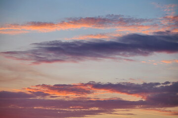 Beautiful evening sky with multi-colored bright clouds. Clouds at sunset