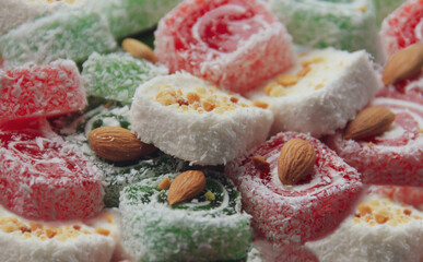Naklejka na ściany i meble Turkish delight in red, white and green colors close-up. Travel and tourism concep