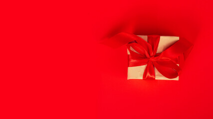 gift box with red ribbon and bow on colored background. copy space. Happy Christmas, New year, Birthday, Valentines day, Womens day