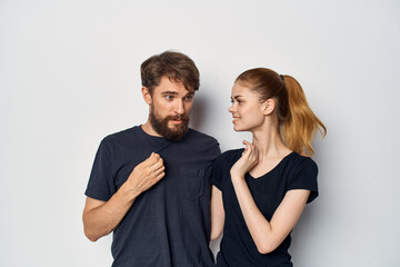 Fototapeta premium married couple in black t-shirt sunglasses posing studio lifestyle