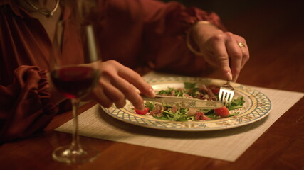 Smiling senior woman eating food at home. Closeup lady enjoy delicious meal