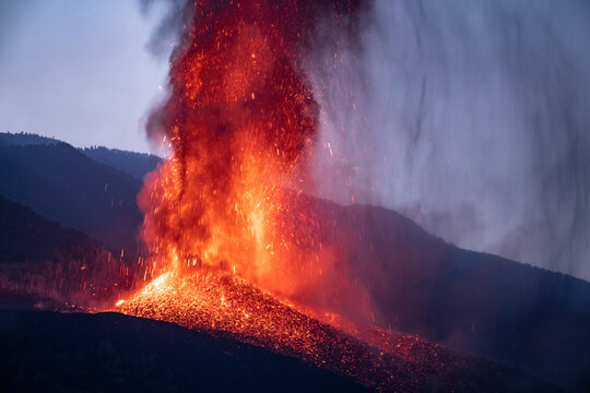 Volcano eruption in evening in mountains