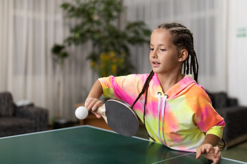 Cute girl playing ping-pong indoors - obrazy, fototapety, plakaty