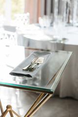 Metal devices for cutting the cake. a golden kitchen spatula and a knife on a napkin.