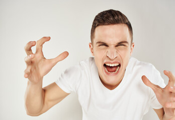 man in white t-shirt emotions displeasure Angry