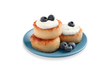 Delicious cottage cheese pancakes with blueberries, honey and sour cream on white background